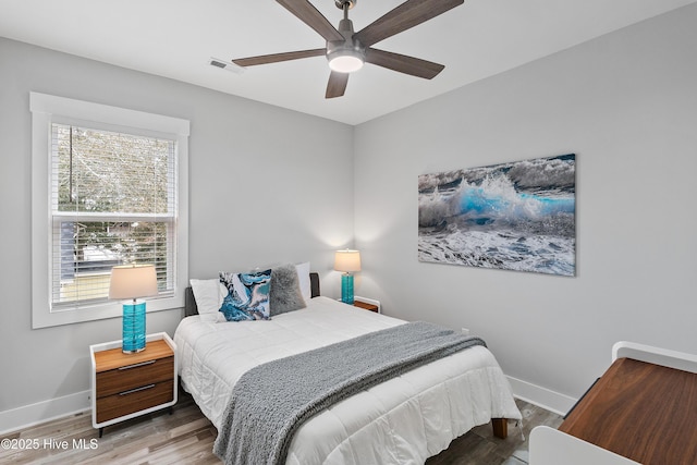 bedroom featuring ceiling fan and hardwood / wood-style floors