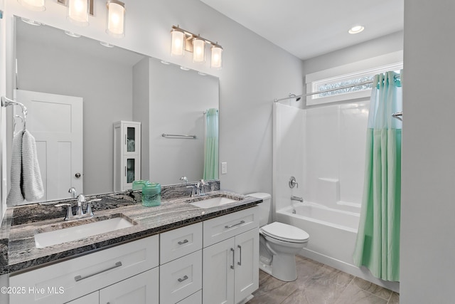 106 SE 36th St, Oak Island, NC 28465 - bathroom featuring toilet, shower / bath combination with curtain, double vanity, and marble finish floors
