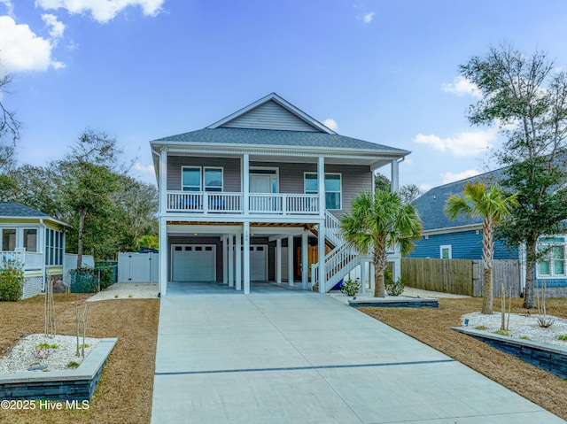 coastal home featuring a porch and a garage