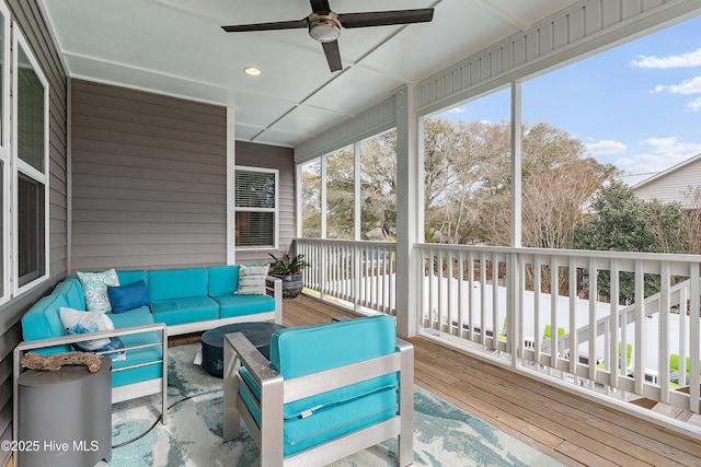 sunroom / solarium with ceiling fan