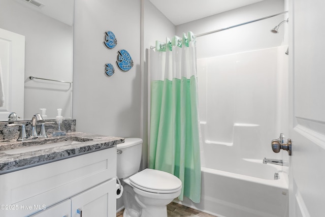 full bathroom with toilet, shower / bathtub combination with curtain, and vanity