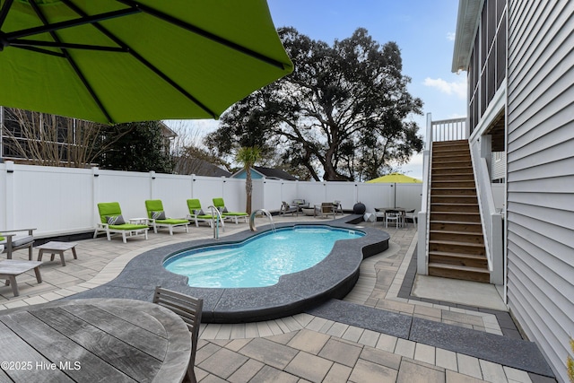 view of swimming pool with a patio area