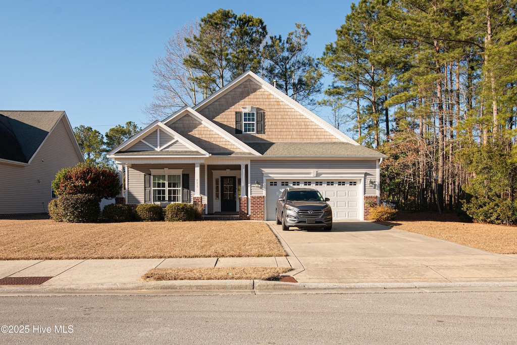 view of front of property featuring a garage and a porch