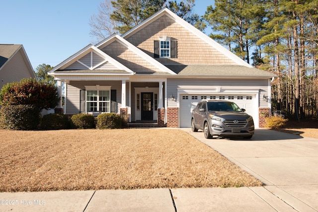 craftsman-style house with covered porch and a garage