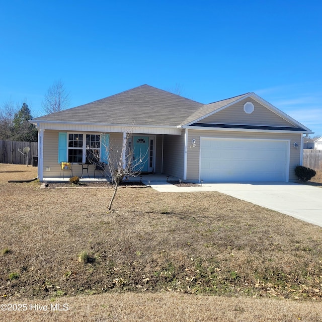 ranch-style house with a garage and a front lawn