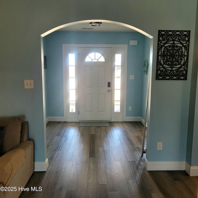 entrance foyer featuring dark hardwood / wood-style flooring