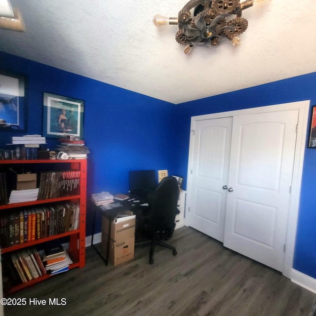 office space with dark hardwood / wood-style flooring and a textured ceiling