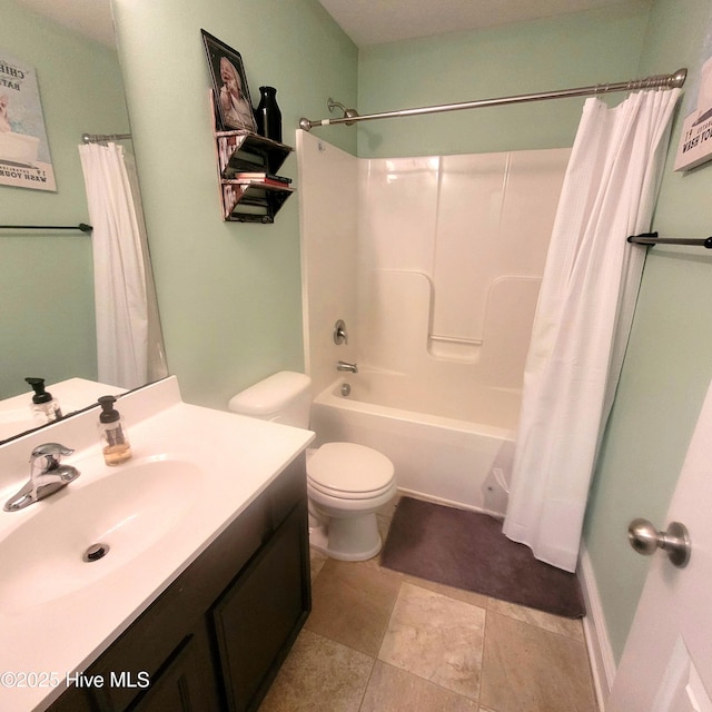 full bathroom featuring shower / tub combo with curtain, vanity, and toilet