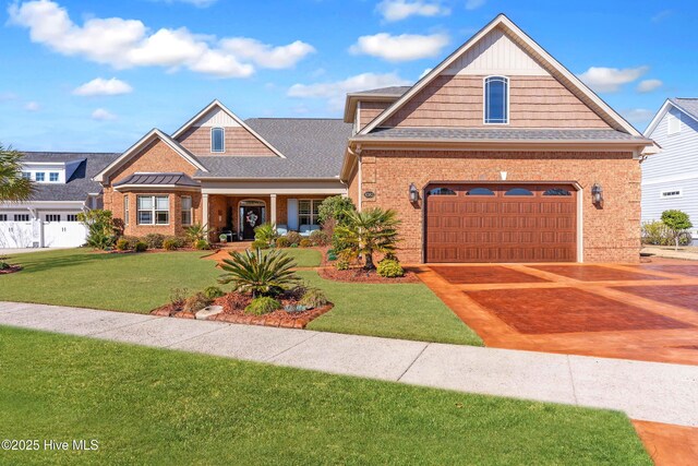 view of front of house featuring a yard and a garage