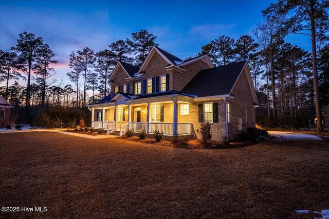 rear view of property featuring a sunroom