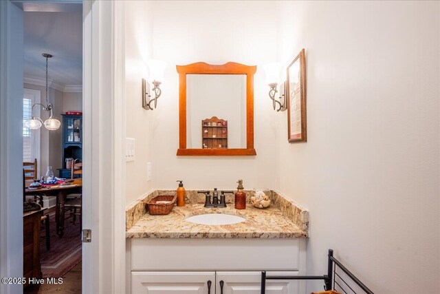 bathroom featuring vanity and crown molding