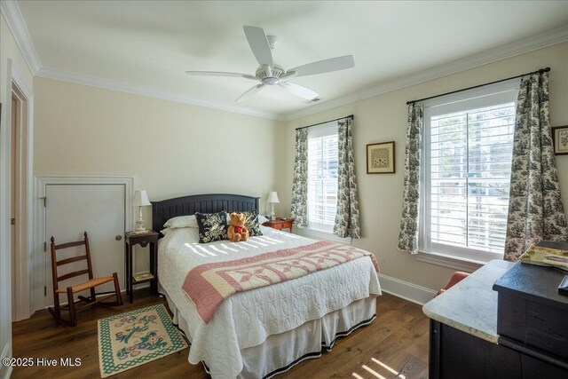 bedroom featuring visible vents, crown molding, ceiling fan, dark wood-type flooring, and baseboards