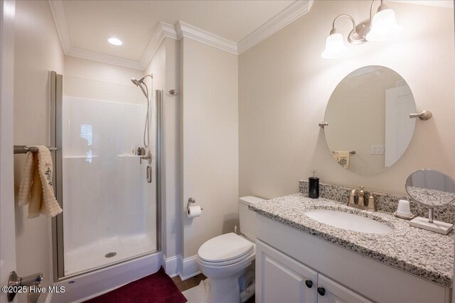 full bathroom with vanity, wood finished floors, a stall shower, crown molding, and toilet