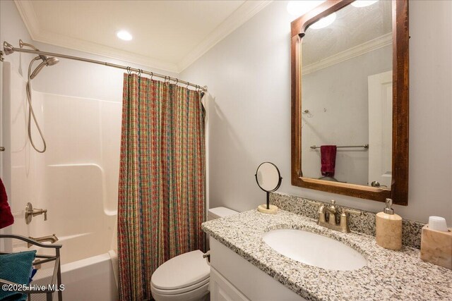 full bathroom featuring vanity, toilet, crown molding, and shower / bath combo