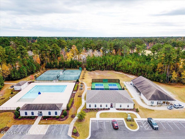 birds eye view of property with a wooded view