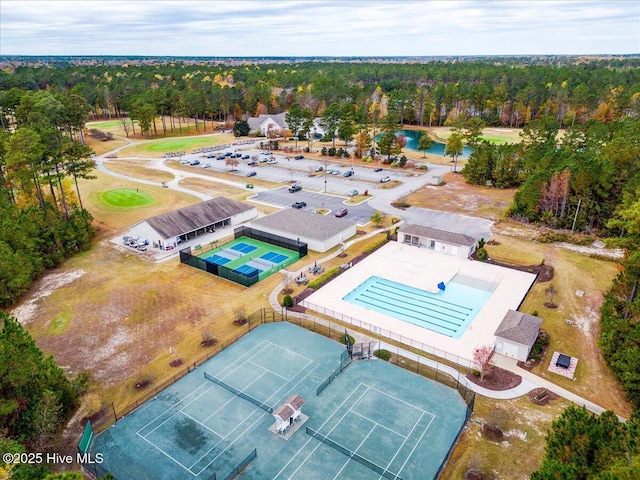 bird's eye view featuring a wooded view