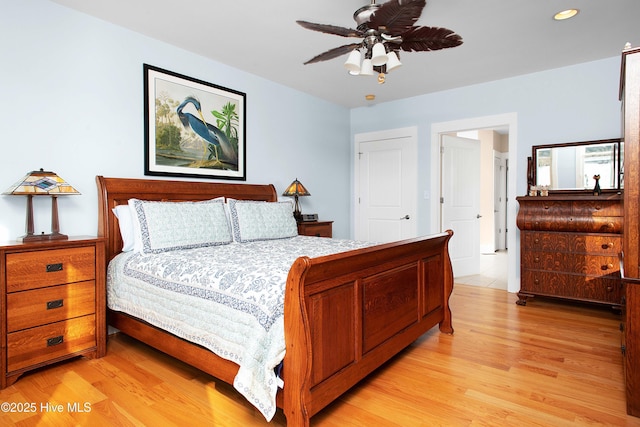 bedroom with ceiling fan and light wood-type flooring