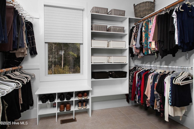 spacious closet featuring tile patterned floors