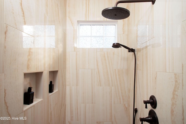 bathroom featuring tiled shower