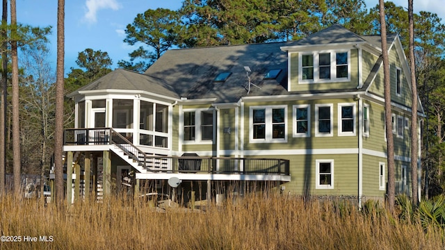 back of property featuring a sunroom