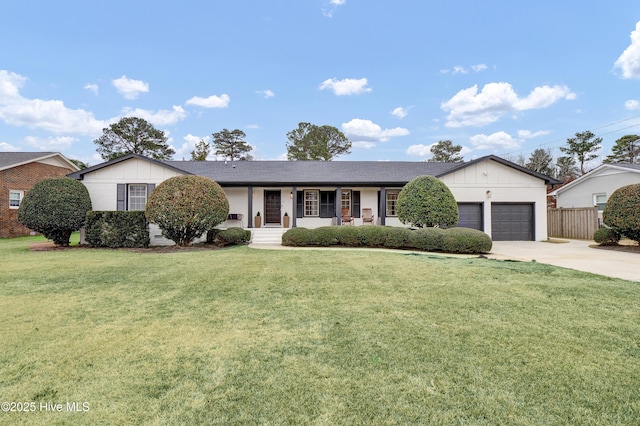 single story home with covered porch, a front lawn, and a garage