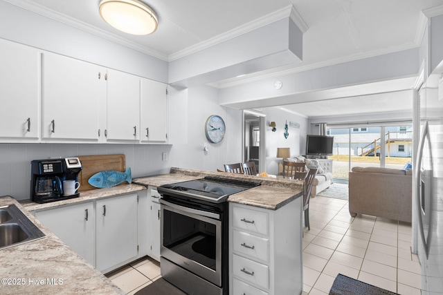 kitchen featuring white cabinets, light tile patterned floors, and appliances with stainless steel finishes