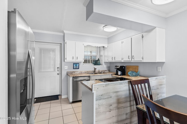 kitchen featuring white cabinets, appliances with stainless steel finishes, light tile patterned floors, and sink