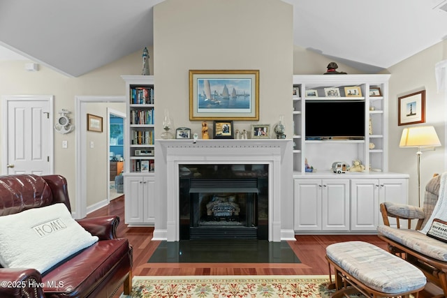 living room with vaulted ceiling and dark hardwood / wood-style floors