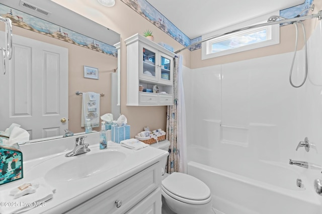 full bathroom with vanity, toilet, and shower / bath combo with shower curtain