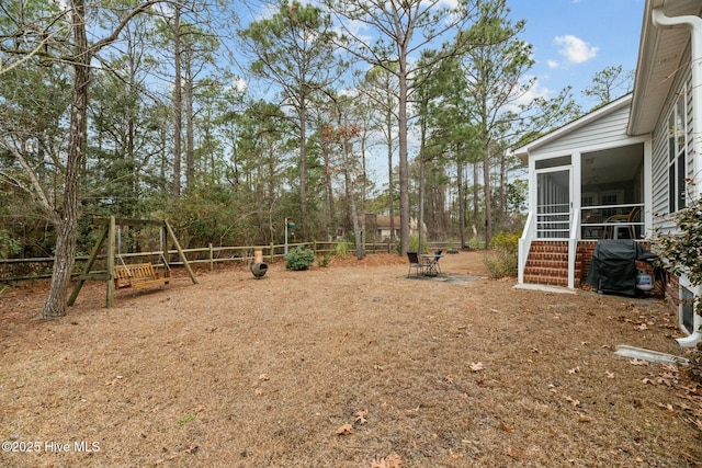 view of yard with a sunroom