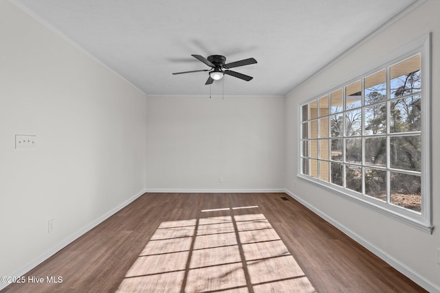 empty room featuring dark hardwood / wood-style floors and ceiling fan