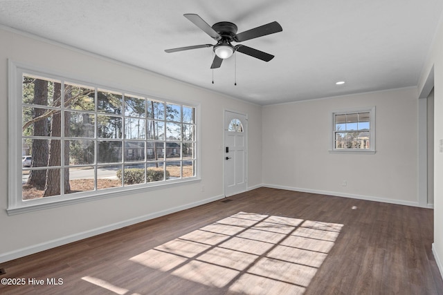 entrance foyer featuring ceiling fan and dark wood-type flooring