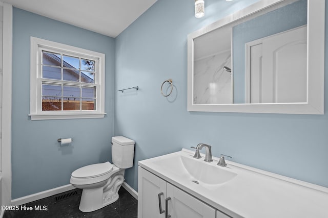 bathroom featuring tile patterned floors, vanity, and toilet