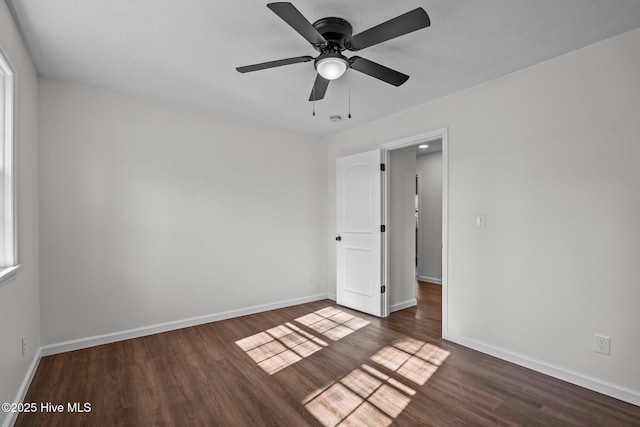 interior space with ceiling fan and dark hardwood / wood-style flooring