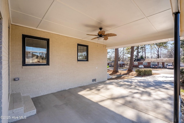 view of patio featuring ceiling fan