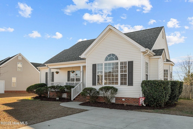 view of front of home with a porch and a front lawn