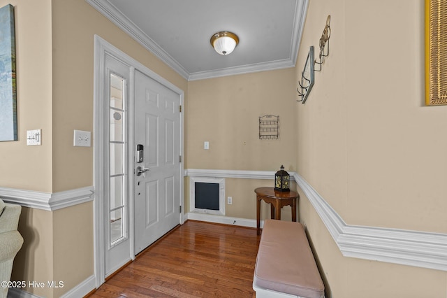 entryway with hardwood / wood-style floors and ornamental molding