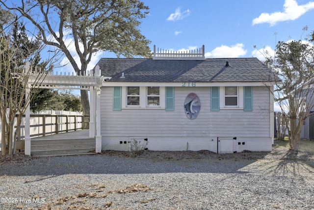 back of house with a deck and a pergola