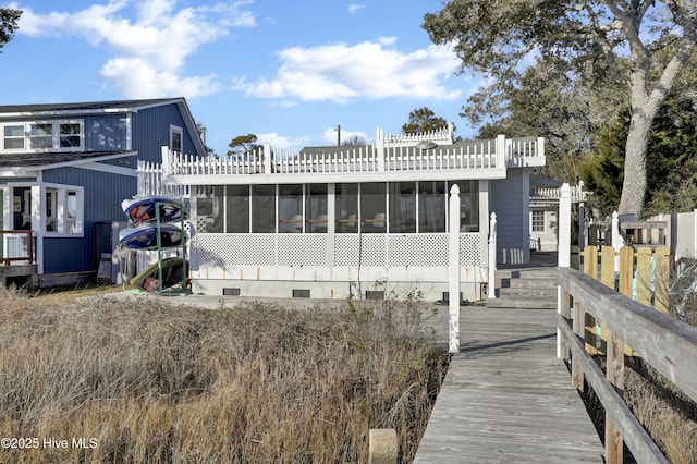 rear view of house with a sunroom