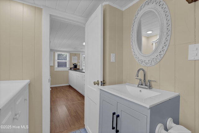 bathroom with hardwood / wood-style floors and vanity