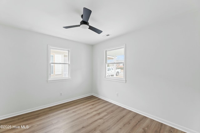 unfurnished room with ceiling fan and light hardwood / wood-style floors