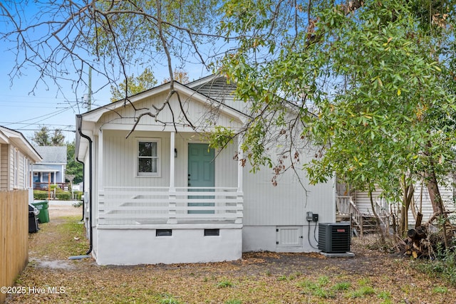 view of front facade with a porch and central AC unit