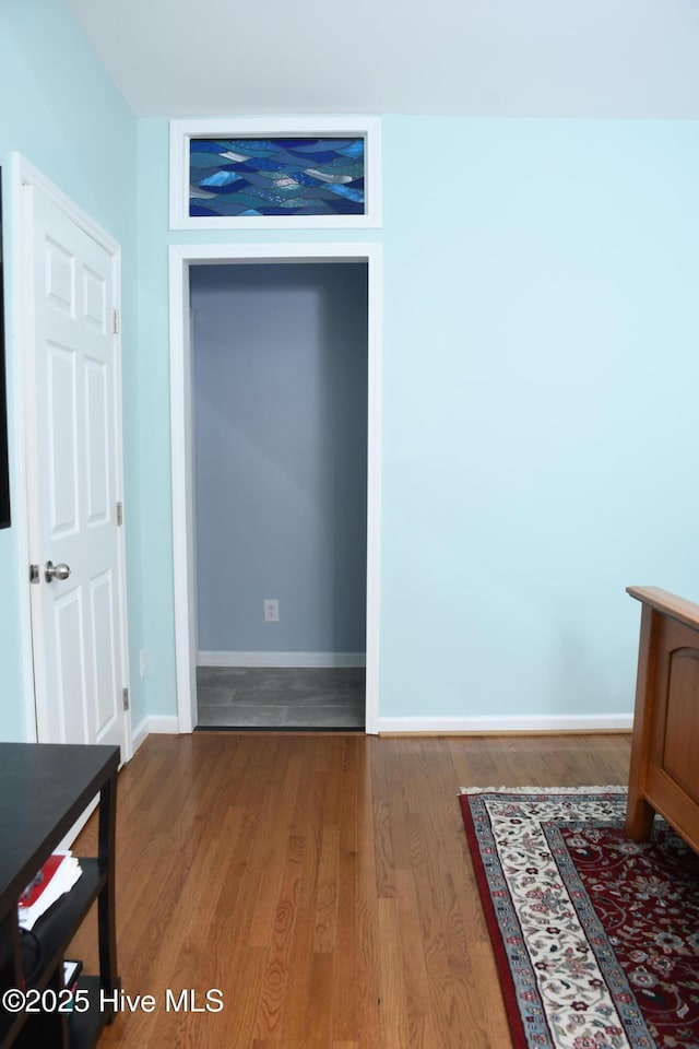 bedroom with hardwood / wood-style flooring