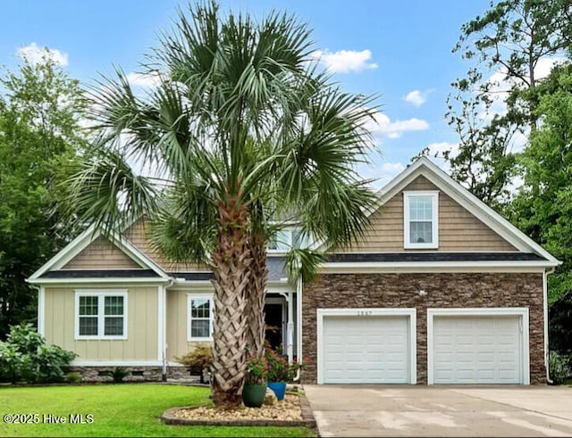 view of front of home with a garage and a front yard