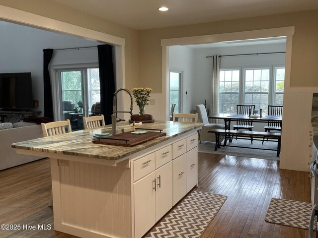 sunroom / solarium featuring ceiling fan and wood ceiling