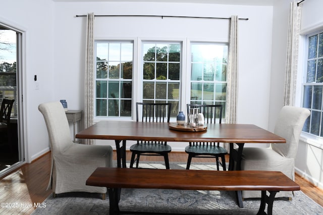 dining area with hardwood / wood-style flooring