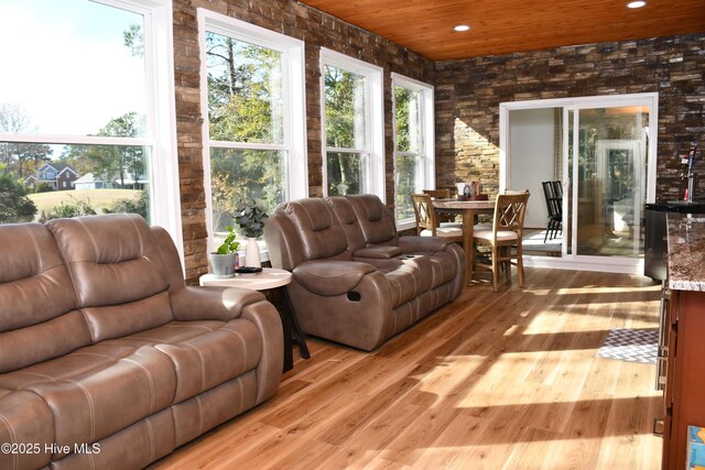 unfurnished sunroom featuring ceiling fan