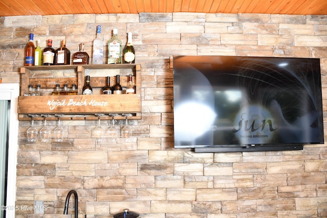 details featuring bar area and wooden ceiling