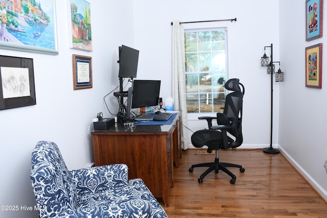 office with hardwood / wood-style flooring