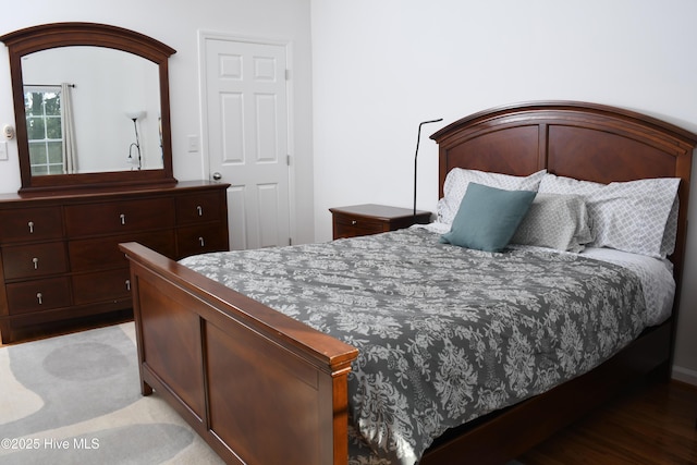 bedroom with hardwood / wood-style floors